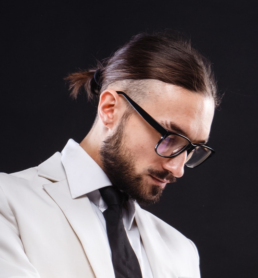 man bun with shaved sides and glasses