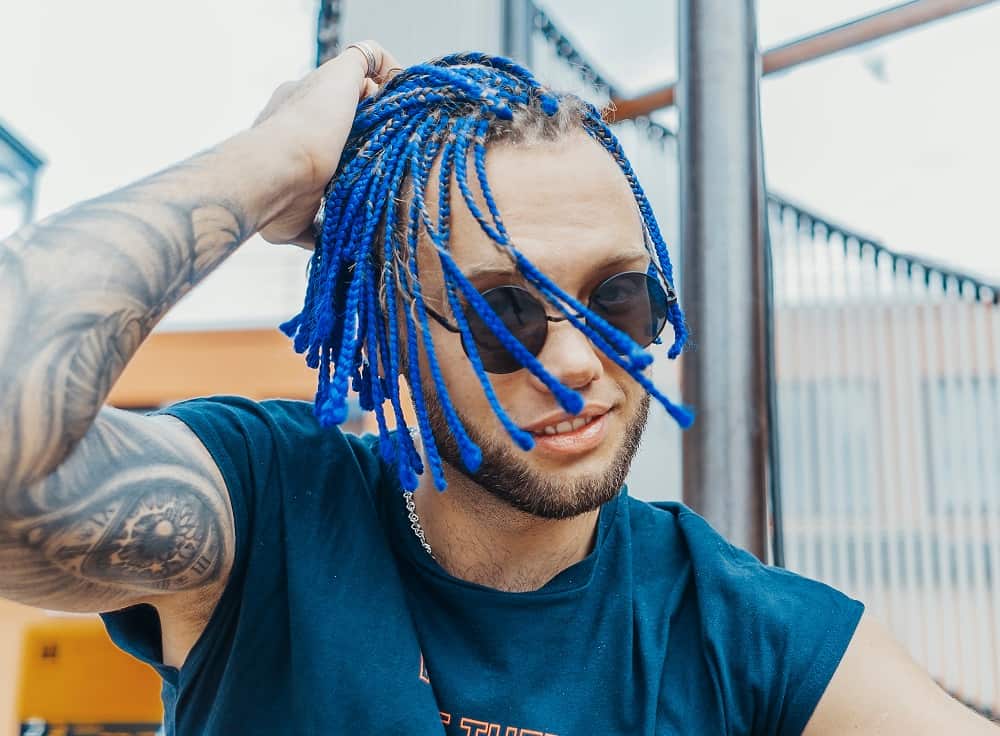 man with blue box braids