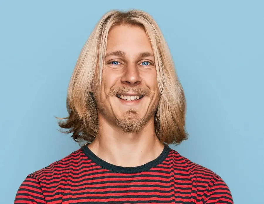 man with long straight blonde hair