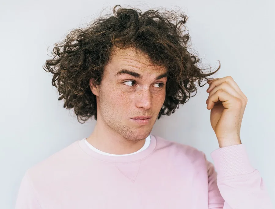 man with unruly thick curly hair