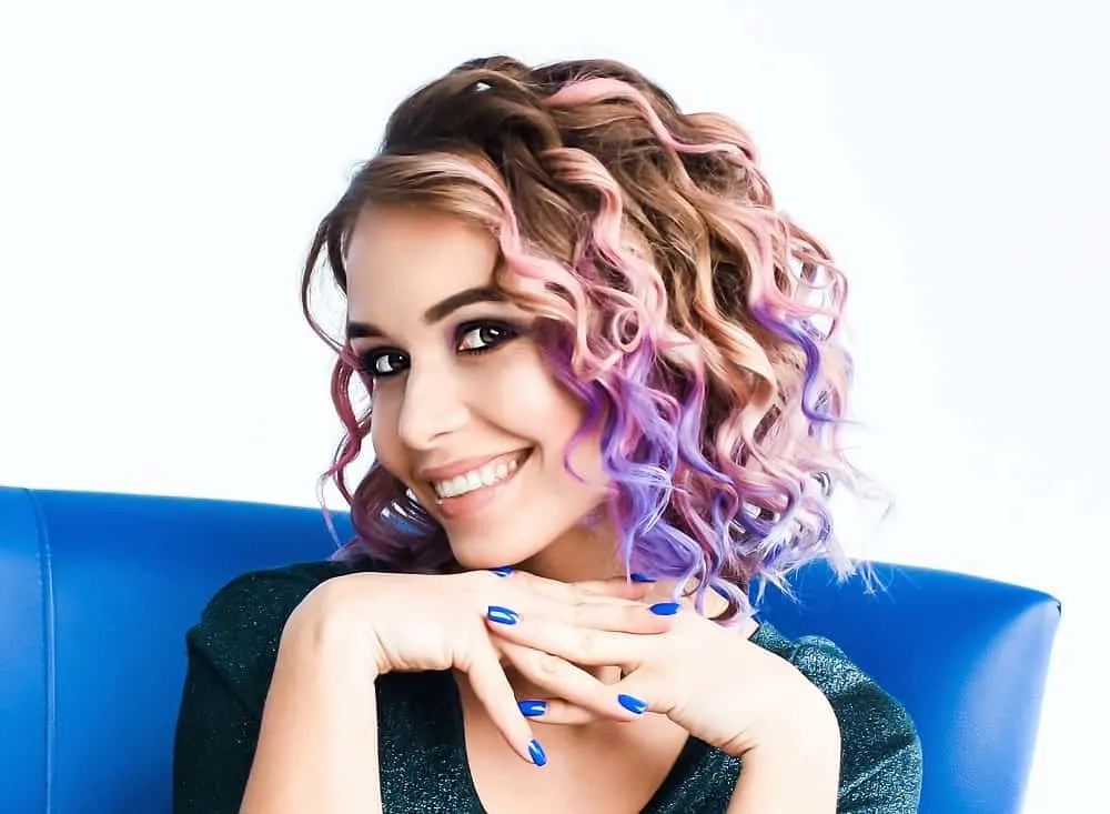 medium brown curls with purple highlights