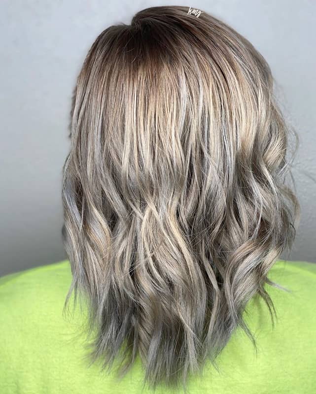 medium brown hairstyle with silver highlights