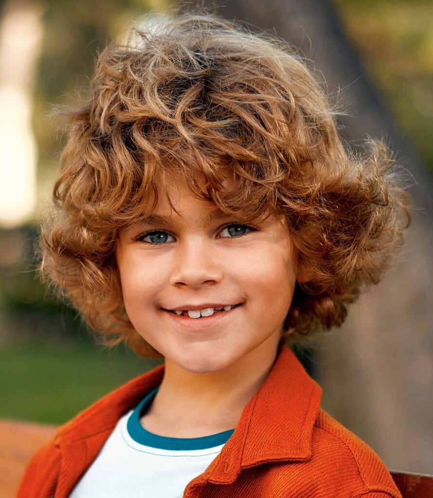 medium curly hairstyle for middle school boy