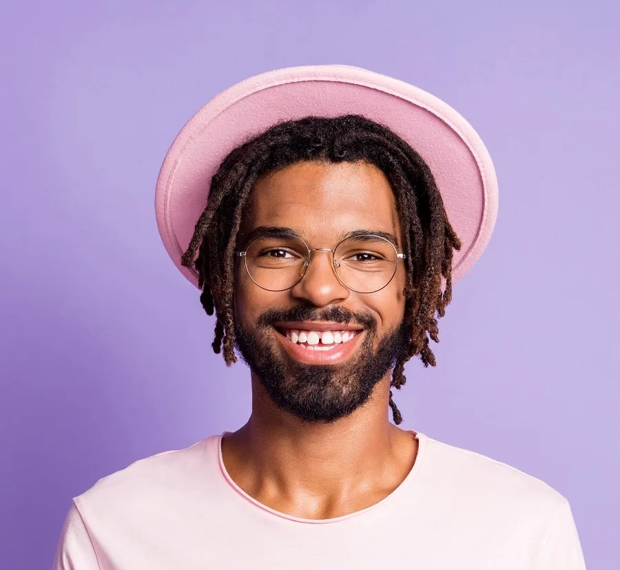 medium dreads with hat for men