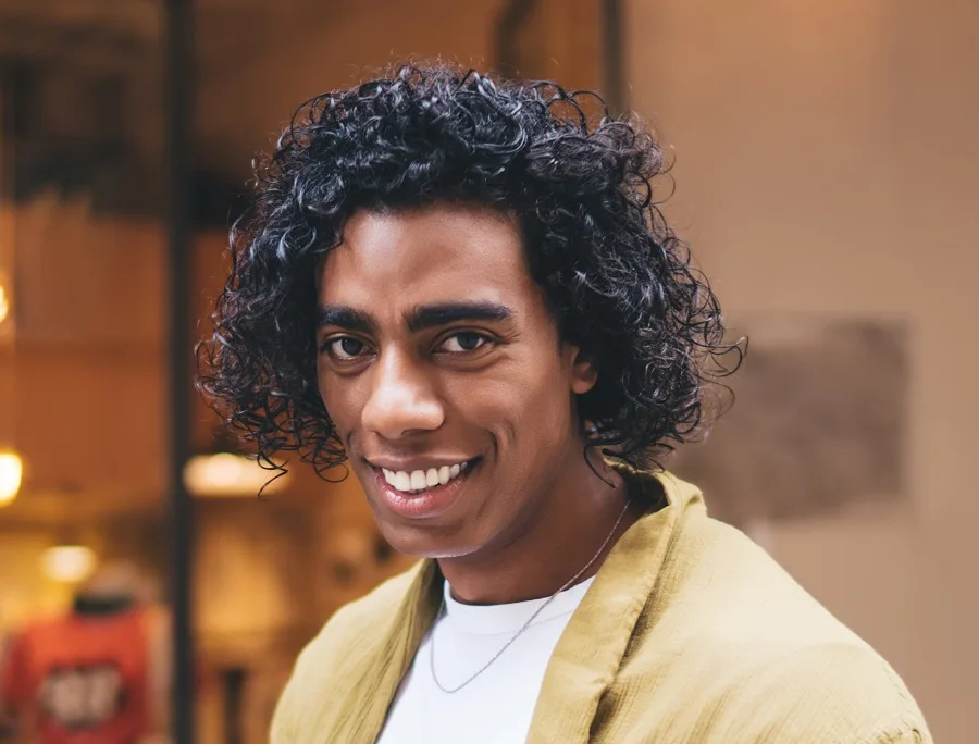 medium curly hairstyle for men