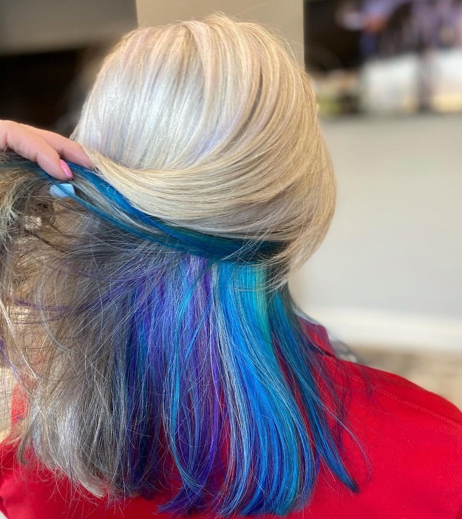 Medium length blonde hair with blue underneath