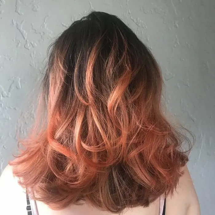 orange balayage on thick medium length hair