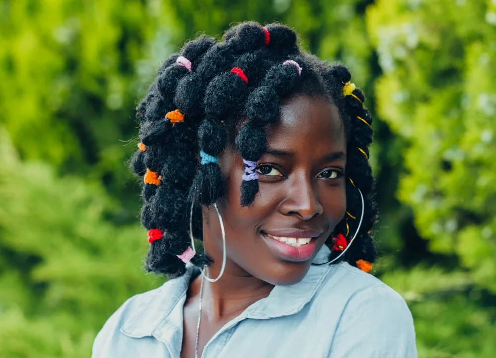 medium-length rubber band hairstyle for black girls