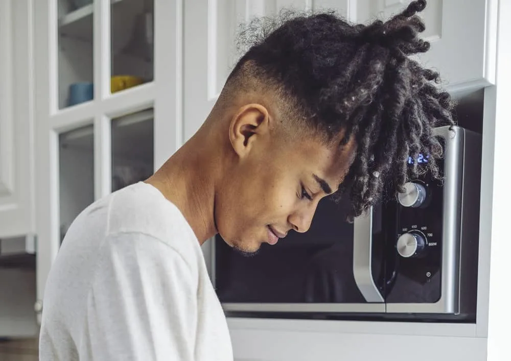 men's dreadlocks style with high taper fade