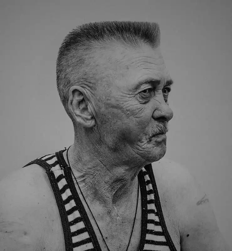 older man with flat top hair