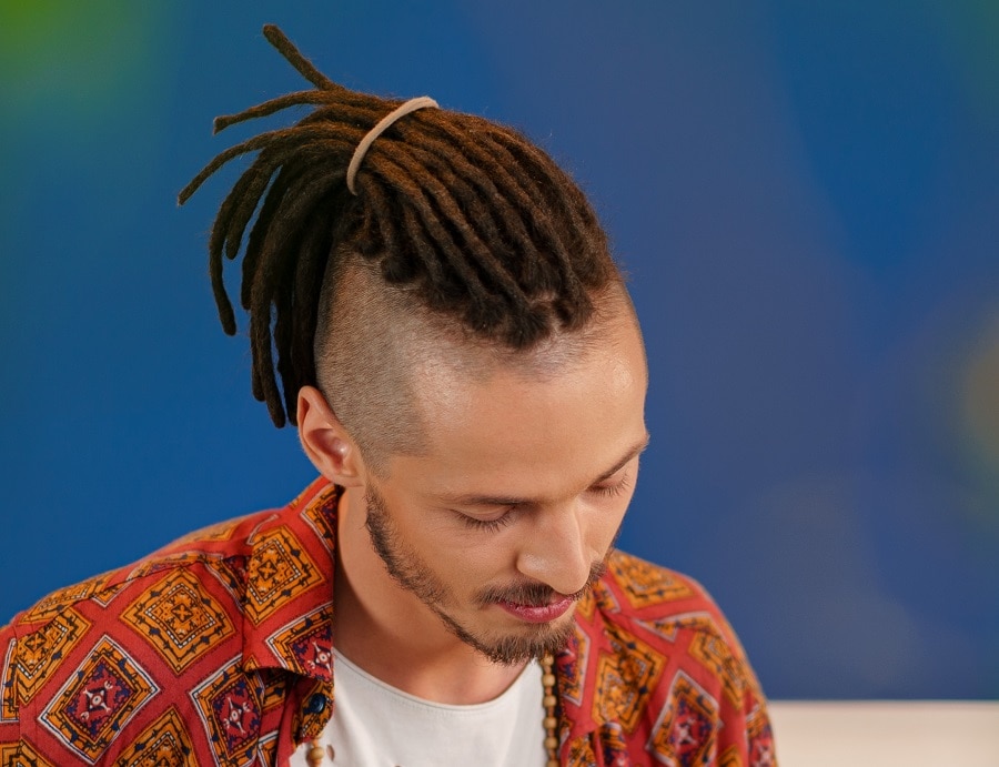 Hippie hairstyle for men with shaved side