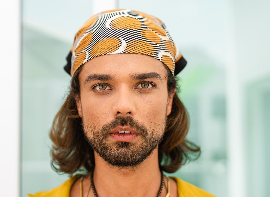 Hippie hairstyle for men with a bandana