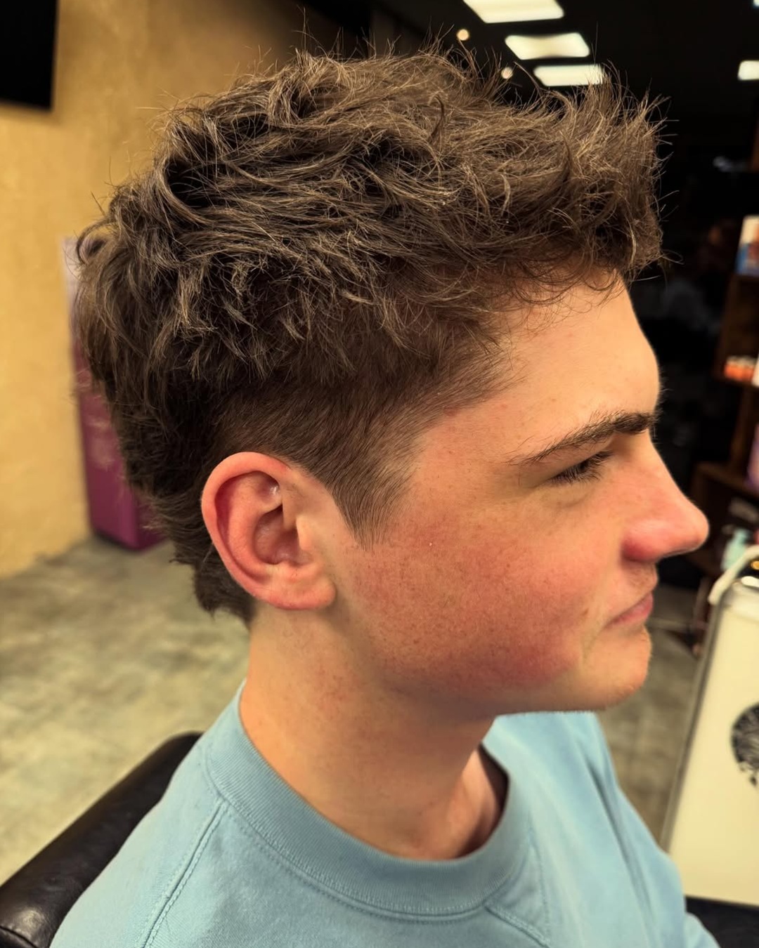 textured short fohawk with longer top haircut 