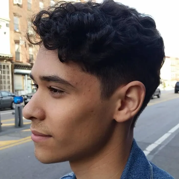 Boy with punk hairstyle in street from behind Stock Photo  Alamy