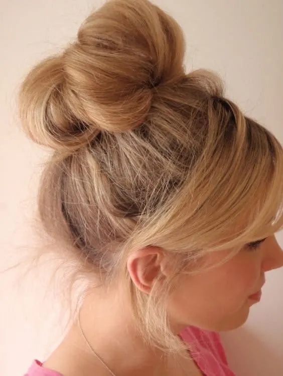 messy sock bun with bangs