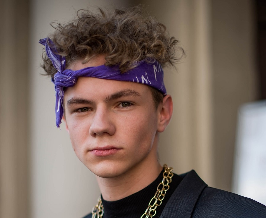 messy curly hairstyle for men with bandana