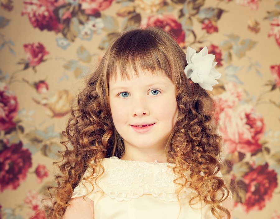 messy flower girl hairstyle with pin