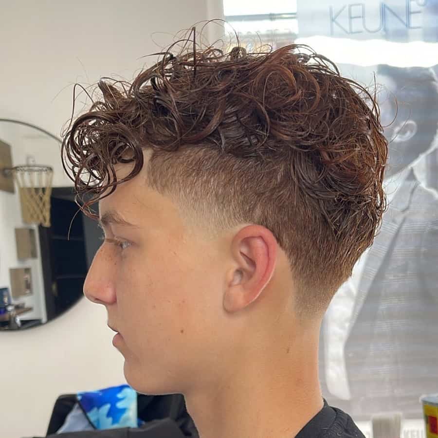 messy hair with taper fade