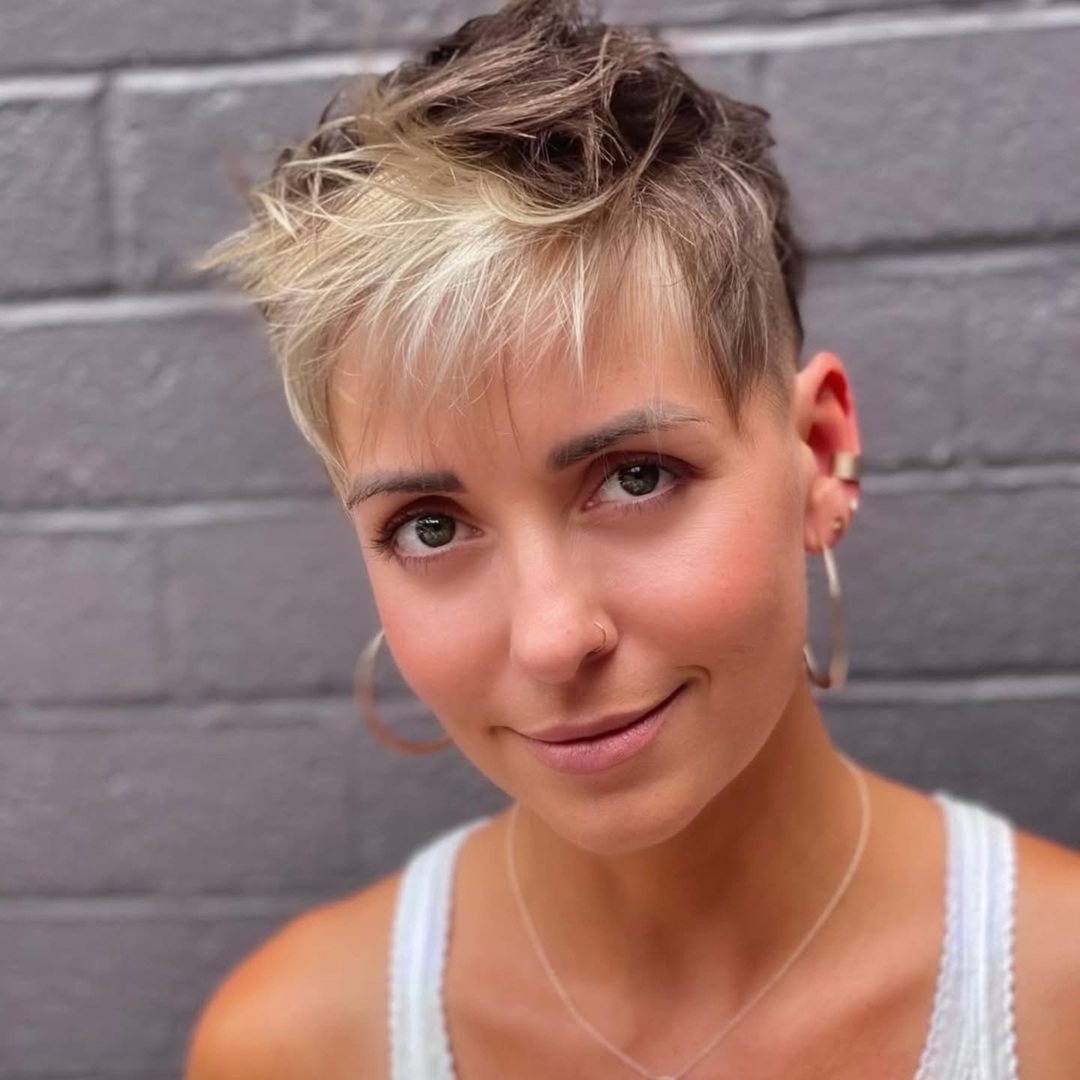messy blonde pixie undercut for women with textured fringe
