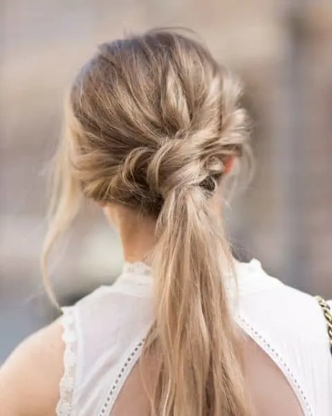 women with knotted messy ponytail
