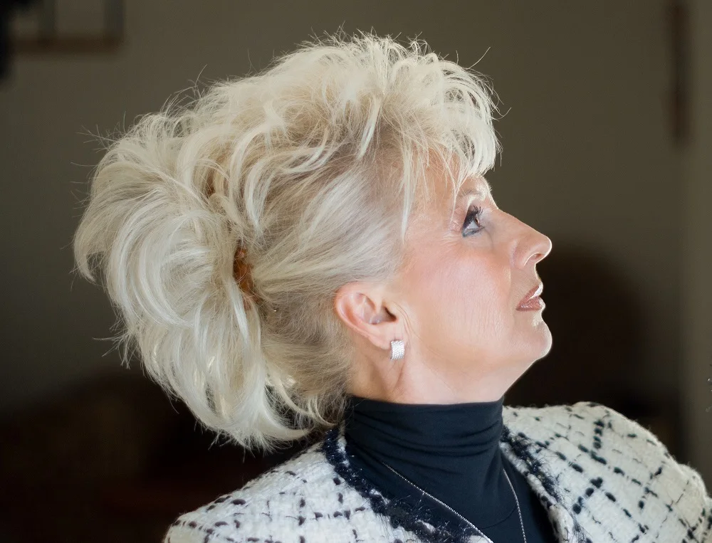 messy updo hairstyle for women over 50