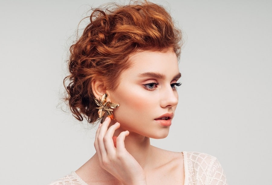 messy updo with long red hair