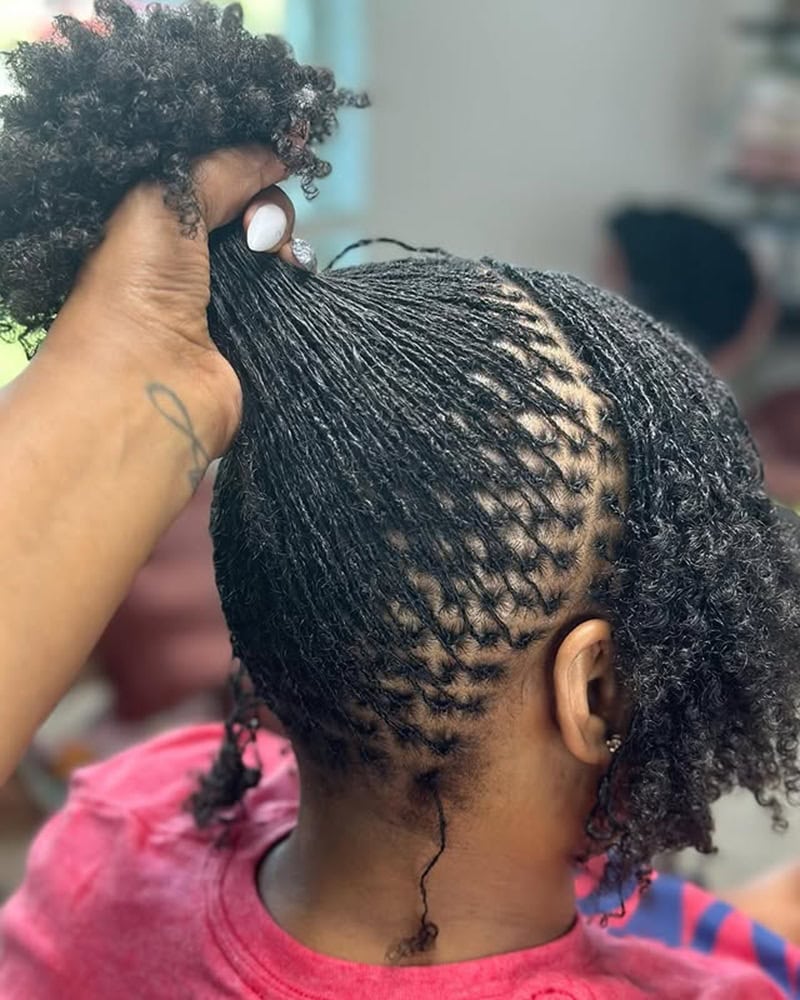 Neatly parted microlocs on natural hair