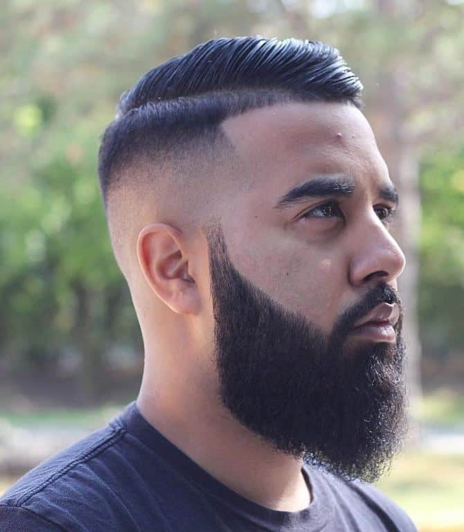 guy with comb over mid fade