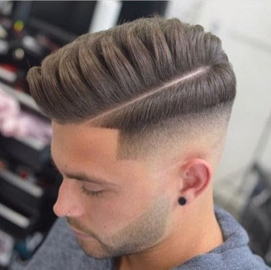 Mid taper fade with comb-over