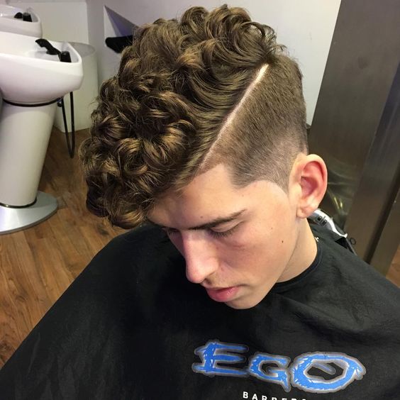 Mid taper fade with curly hair