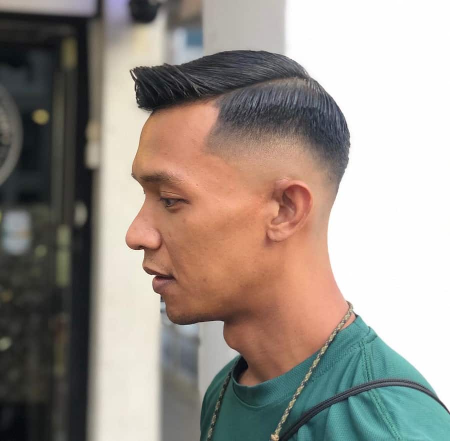 mid taper fade with comb over