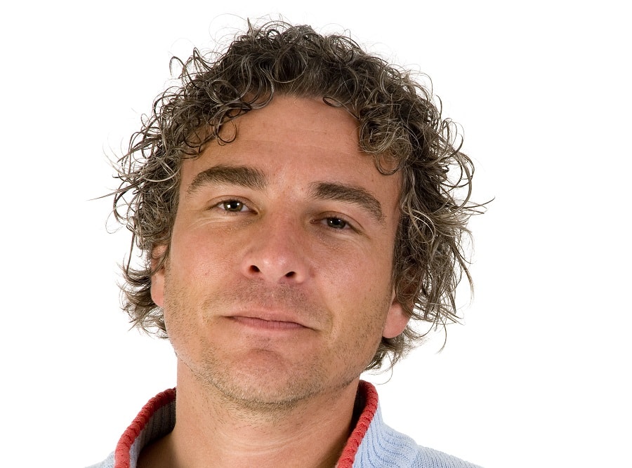 middle aged guy with tight perm hairstyle