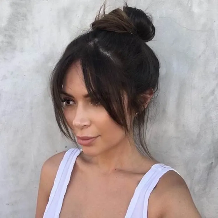 Middle Part Bangs with Messy Top Bun