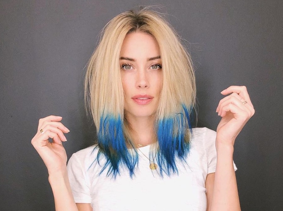 Middle part blonde hair with blue tips