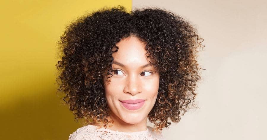 Image of Curly shag afro with center part