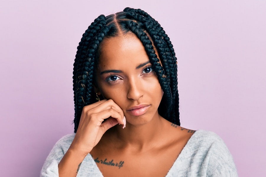 middle parted dookie braids hairstyle