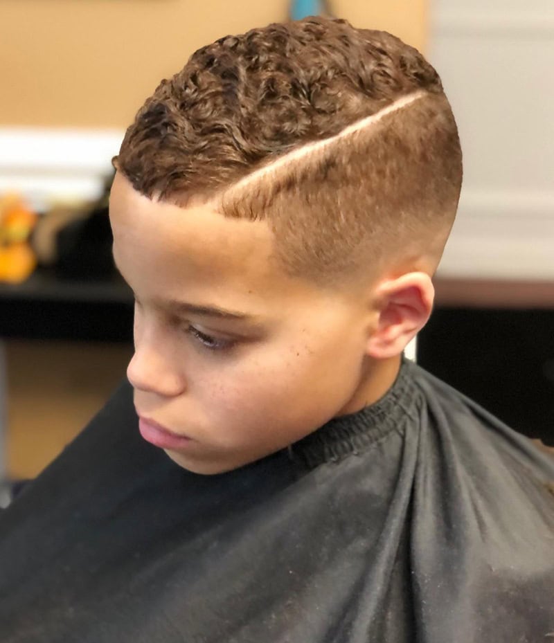 Short afro comb over with razor hard part for boys
