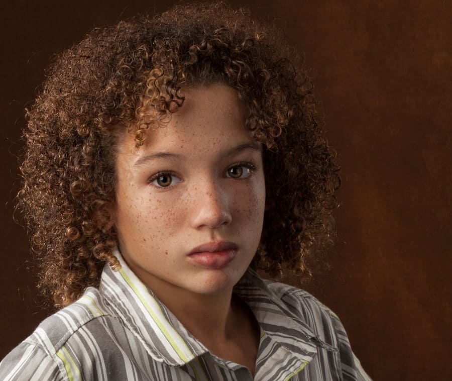 mixed boy's curly hair with bangs
