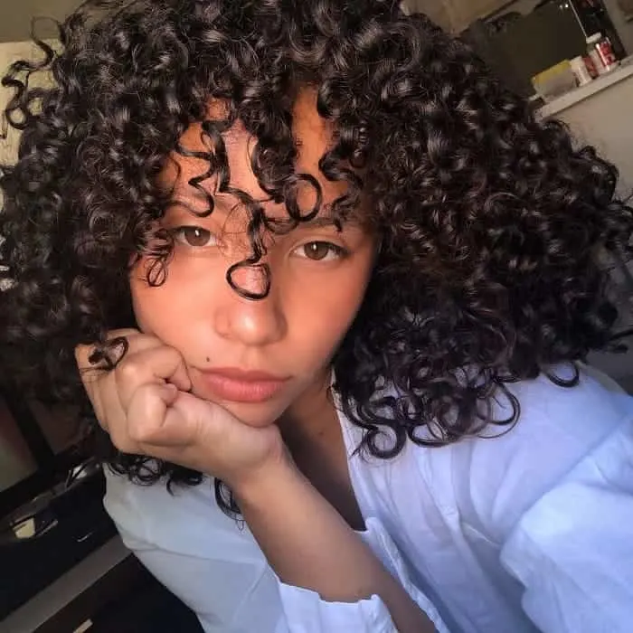 mixed girl afro hair with curly bangs