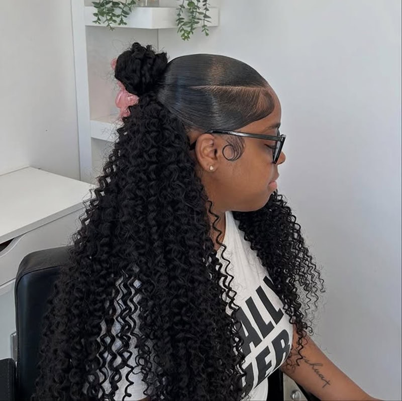 Mixed girl with sleek long curly half up top knot
