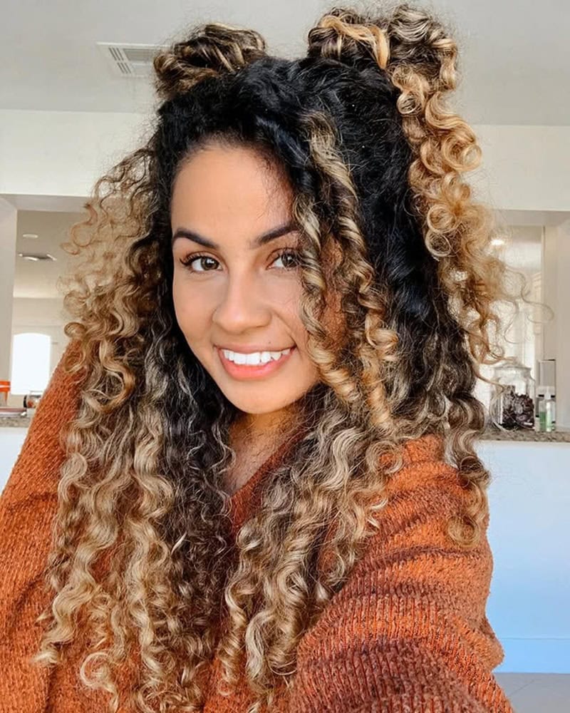 Mixed girl with curly half up double space buns