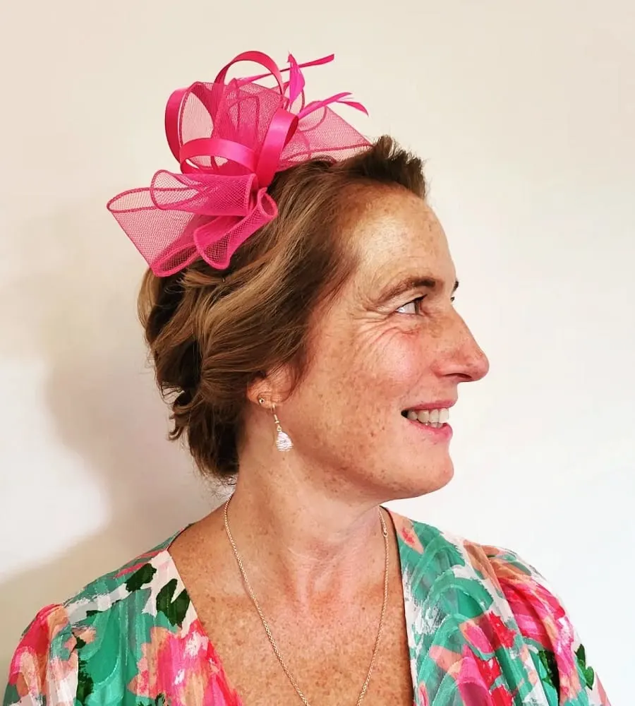 mother of the bride hair up with fascinator