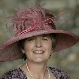 mother of the bride hairstyle wearing a hat