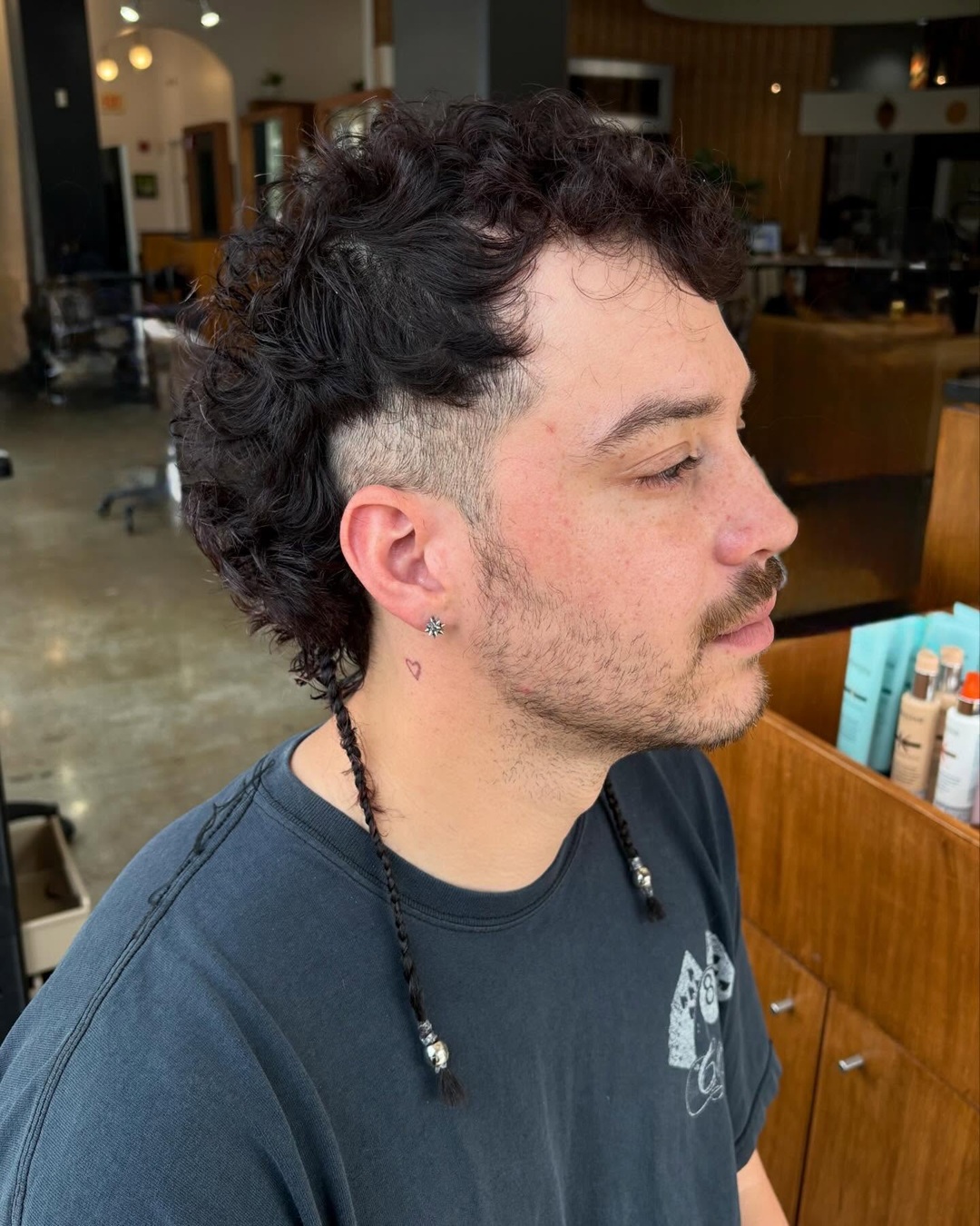 curly burst fade mullet mohawk with braided rat tails