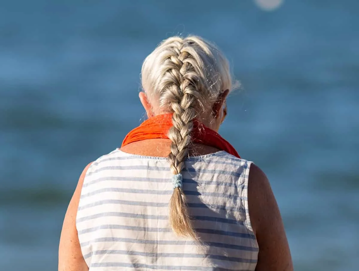 older woman with french braid