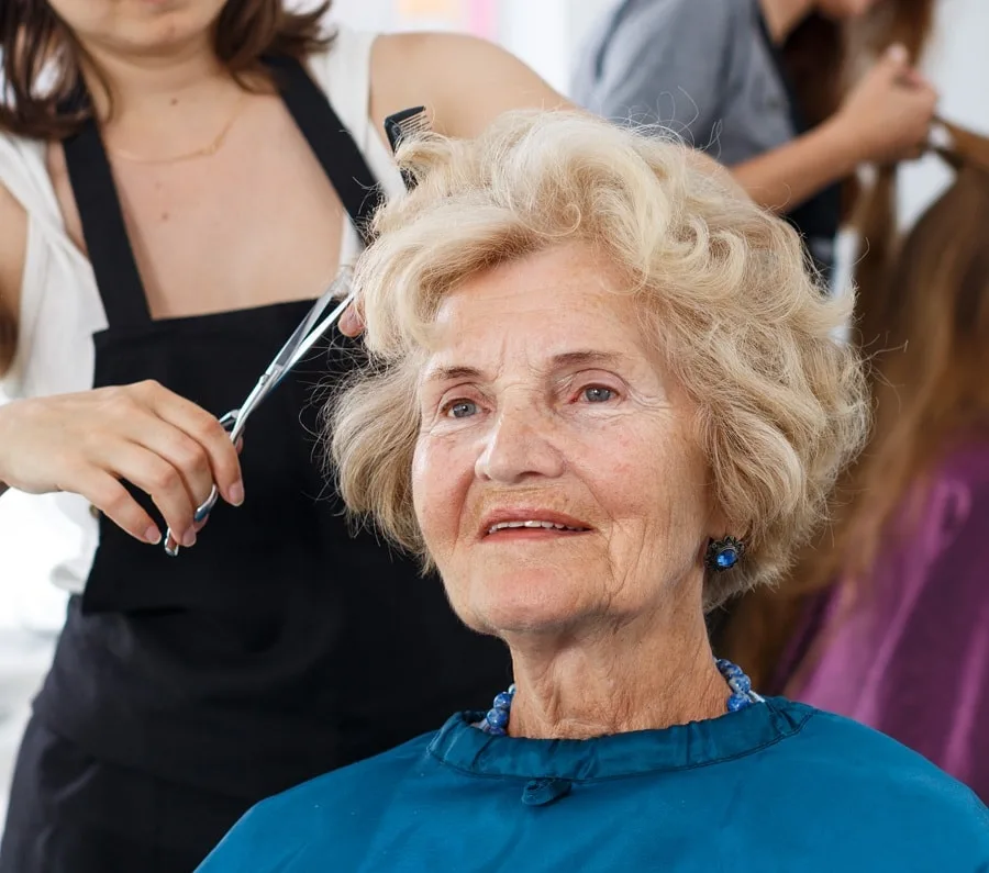 older women cutting hair short