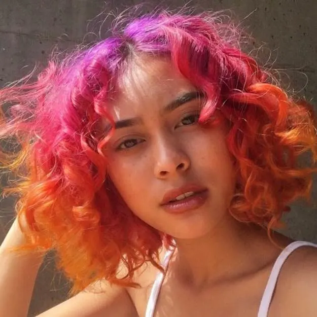 curly pink and orange ombre hair