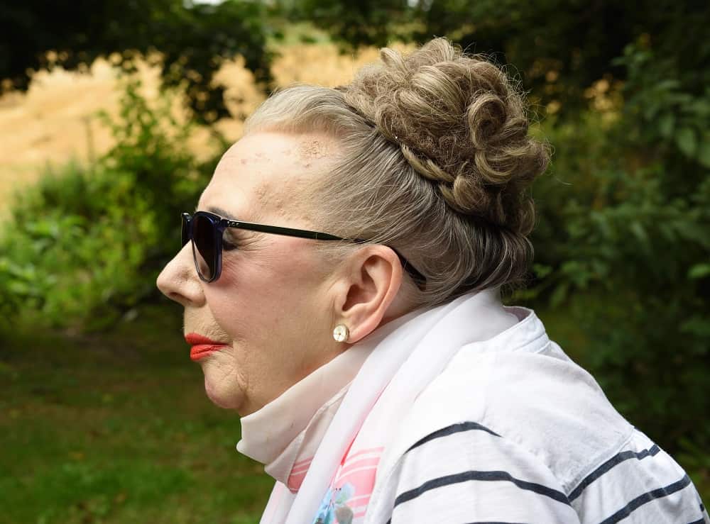 over 50 woman with curly bun