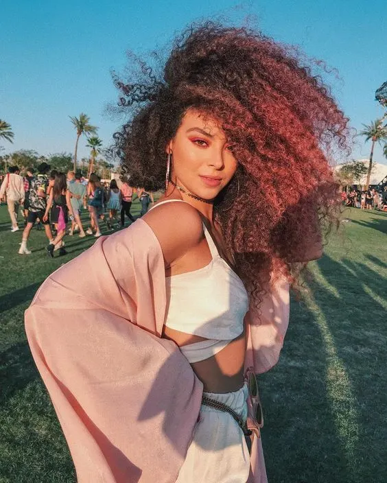 women with afro pink hair