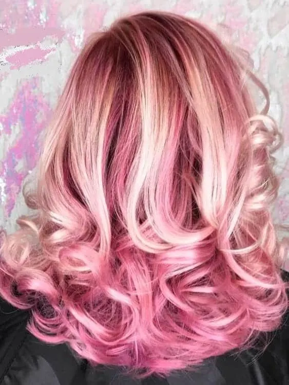 wavy blonde hair with pink highlights